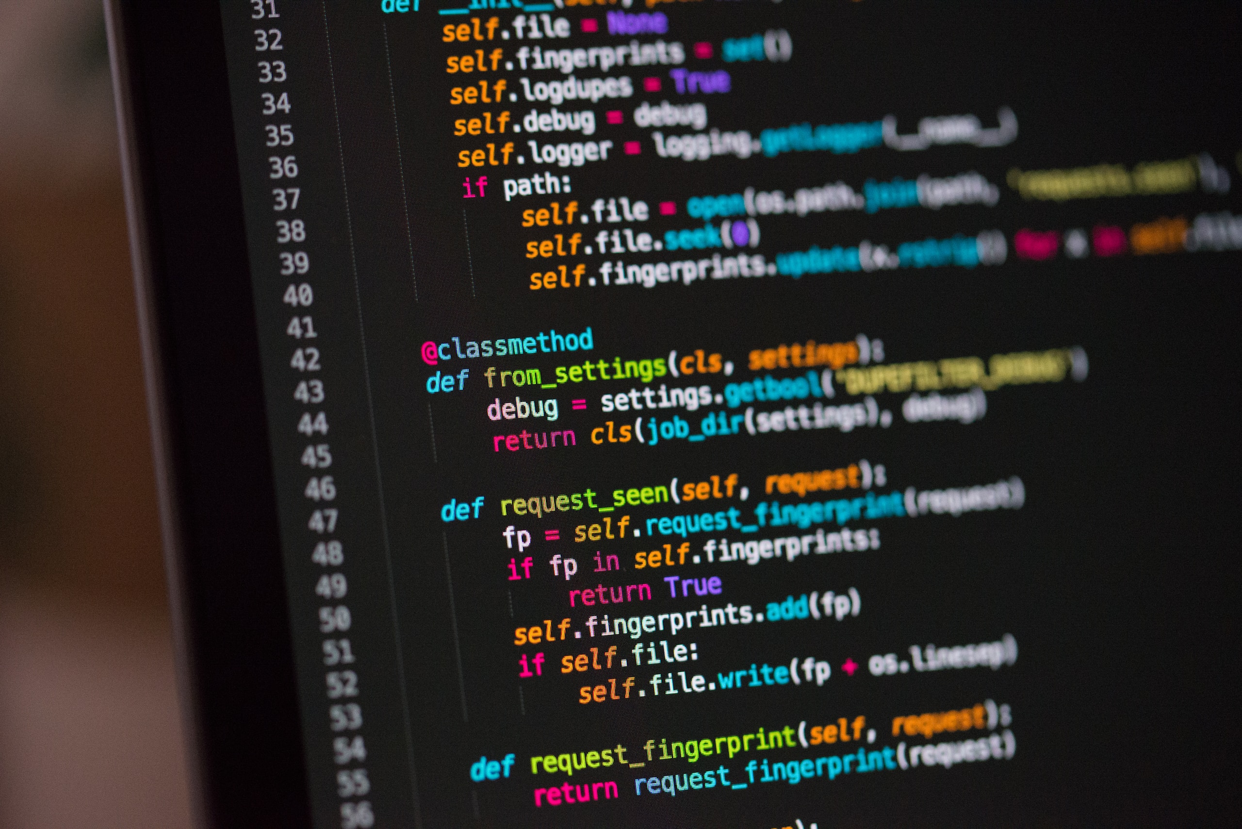 A computer screen showing code with multicoloured syntax highlighting